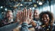 © Asree - A diverse business team around a table in a bright meeting room, high-fiving with digital holographic success trophies and confetti popping up