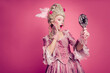 © deagreez - Photo of shocked lady princess hold loom mirror enjoying festive antique event isolated pink color background