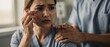 © Pornfa - Emotional Healthcare Scenario with Concerned Woman and Supportive Caregiver in Medical Environment Depicting Compassion and Understanding in Difficult Times
