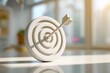 © Minakhi - Achievement symbolized by bullseye with perfectly placed arrow in modern setting