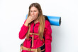 © luismolinero - Young mountaineer girl with a big backpack over isolated white background yawning and covering wide open mouth with hand