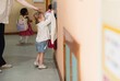 © AresStudio Belen y Carlos/Stocksy - Child learning independence by hanging clothes in kindergarten