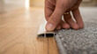 © Mahmuda - installing aluminum door threshold strip | carpet to wood floor transition bar | DIY home flooring renovation project | metal transition strip for floor levels