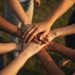 © Alex Pios - Diverse Hands Stacked Together, Concept of Unity and Collaboration