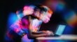 © ADDICTIVE STOCK - Black man using laptop with colorful light effects at night