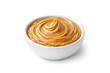 © Natalia - A close-up photo of a delicious caramel dip served in a small white bowl on a table.