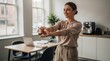 © AimanHakim - Office Worker Doing Arm Stretches Near Desk