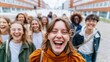 © Breezze - Laughing group of multiracial young adults walking on a city street with candid joyful expressions for friendship and urban lifestyle content
