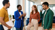 © ADDICTIVE STOCK - Diverse team meeting to discuss project in modern office