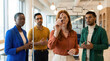 © ADDICTIVE STOCK - Business team planning project workflow on office whiteboard