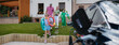 © Halfpoint - Happy family leaving home for summer vacation with luggage and pool toys.