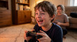 © Morrina - Video Game Day excited boy playing console games sitting on floor laughing joyfully at home for entertainment technology youth culture casual gaming lifestyle content