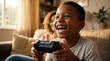© Jian - Video Game Day happy African American boy playing console games laughing with joy at home for entertainment technology youth culture gaming lifestyle diversity content