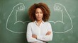 © Sudarti - Proud African American woman standing before a chalkboard with drawn muscular arms symbolizing female strength and confident empowerment.