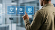 © umi - Strategy Selection: A businessman selects Mission from a digital display showing Values, Vision, and Mission, representing strategic business planning.