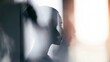 © Bonsales - Young woman's abstract profile reflection, creating an ethereal silhouette through blurred glass, embodying introspection and vision