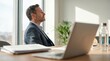 © N7 - Corporate Wellness and Mental Health Concept: Side Profile of Mindful Businessman Taking a Deep Breath and Meditating in Bright Modern Office for Stress Relief and Work-Life Balance