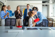 © Miljan Živković - Colleagues celebrating coworker receiving a gift and a kiss