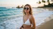 © mlangsen - Young Woman in White Bikini Enjoys a Tropical Beach Sunset.