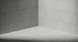 © LensPilot - Minimalist corner interior design featuring a cimento queimado wall texture and light gray tiled floor with soft natural lighting for modern home decor.