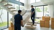 © kitti - Professional movers carrying wrapped sofa down stairs in modern house relocation service concept.