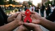 © MMerellinn - Collective solidarity gesture: HIV awareness, AIDS symbol, Human care, Immunodeficiency support, Virus fight, Acquired emblem, Syndrome hope, red ribbon, community unity.