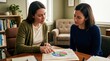 © Aliaksandra - financial therapy session, a therapist and client discuss a pie chart in a tranquil office setting
