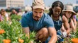 © oksa_studio - Volunteers working together in a community garden for team work and gardening fun