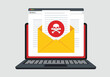© md - Laptop computer screen displaying email with red skull and crossbones warning icon, concept of dangerous virus or malware attack.