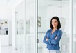 © Songpong - Confident businesswoman, professional office setting, modern interior, corporate environment