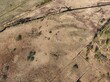 © AmazingAerialAgency - Aerial view of World War II decoy trenches shaped like aircraft outlines in a field near Liepaja Airport, Liepaja, Latvia.