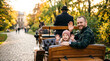 © drimerz - Happy father and daughter waving from horse carriage in park