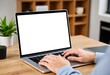 © EkaDewi - Person typing on laptop with blank screen on wooden desk in office