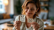 © Denis Yevtekhov - Woman holding contrasting happy and sad face cards to express changing emotions in a safe welcoming environment with warm neutral colors and authentic human emotion, showing mindfulness,