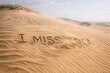 © Fotograf - A heartfelt message 'I miss you' written in the sand on a peaceful beach