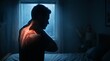 © Abimusa Gallery - A man experiencing neck and shoulder pain in a dimly lit room, highlighted to show discomfort.