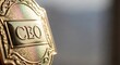 © SashaMagic - Close-up of a golden CEO badge, signifying executive authority and corporate leadership with elegant texture and copy space