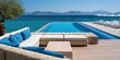 © Ken - Expansive infinity pool with seating and ocean view