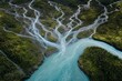 © JIALU - Multiple small streams merging into a single wide river viewed from above, showing water flow patterns.
