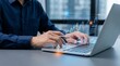 © Studio KN - businessman analyzing financial market data and digital investment charts using laptop, fintech analytics dashboard with global trends, stock performance, and economic strategy visualization
