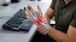 © Flash memory - Man with carpal tunnel syndrome touching painful wrist at office desk. 3D digital illustration of nervous system inflammation. Concept of occupational injury, digital health and pain.