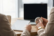 © Aryanedi - Business People Using a Timer for Time Management at an Office Desk