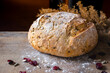 © Ina - Close up of fresh artisan bread loaf with crispy crust. Natural light and rustic surface. Concept of bakery product, healthy eating and traditional food.