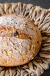 © Ina - Close up of fresh artisan bread loaf with crispy crust. Natural light and rustic surface. Concept of bakery product, healthy eating and traditional food.
