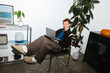 © Julia - The remote work routine of a young man feels easy at home