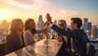 © MdAimanHakimJet - Business team celebrating successful deal with champagne and high fives on rooftop at sunset