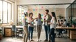 © CuteBee - Group of young creative professionals standing in modern office discussing business ideas on glass wall covered with colorful sticky notes during productive team meeting