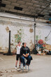 © Luciano Spinelli/Stocksy - Two People in Industrial Warehouse