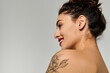 © LIGHTFIELD STUDIOS - A young, beautiful woman showcases her confidence and charm while posing naturally.