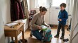 © Maryia - Busy mother packs school backpack while child waits by the door, showing morning rush, parenting pressure and family logistics at home.